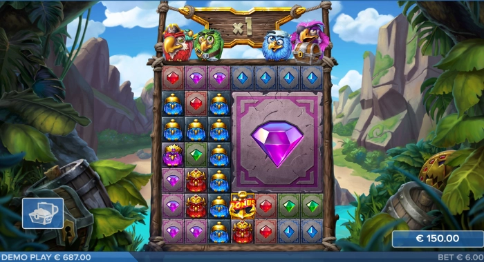 A jungle-themed slot game screen displays a 5x5 grid with various symbols, including several bird characters at the top and gem symbols on the reels, highlighting a large purple gem in the center, with a 